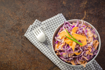 Light cabbage salad with carrot and sour cream sauce. 