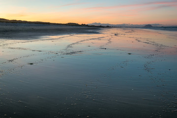 Sunset at Papamoa Beach with Mount Maunganui in the background © Martin Capek