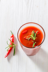Spicy cocktail with tomatoes and chilli peppers