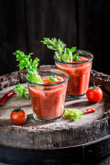 Tasty bloody mary cocktail with chili peppers