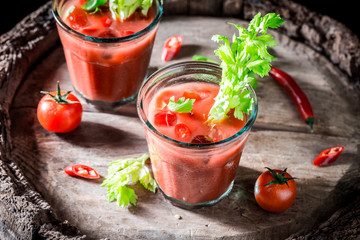 Tasty bloody mary cocktail with fresh tomatoes