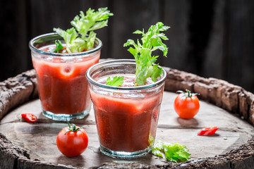 Spicy bloody mary cocktail with tomatoes and celery