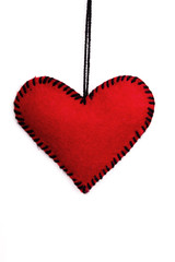 red  felt hearts on a white background, valentines composition, copy space