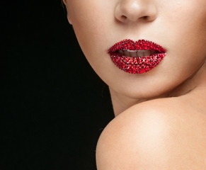Luxury woman with rhinestones on her lips. Holiday Makeup with gems.