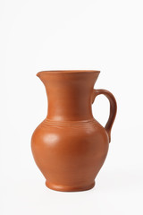 Fototapeta na wymiar Pitcher ceramic with handle. Isolated on white background. Close-up