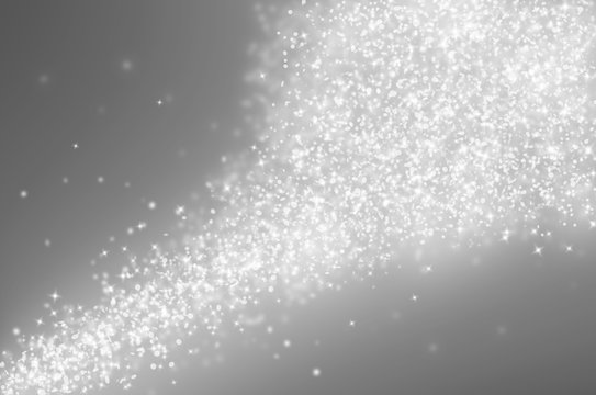 Grey glitter sparkles rays lights bokeh Festive Elegant abstract background.