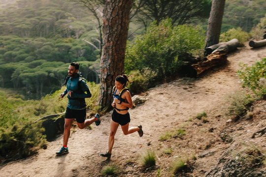 Young couple doing trail running workout