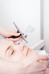 Cosmetologist performs the rejuvenation procedure