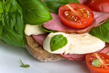 Ciabatta with ham , mozzarella, tomato and basil
