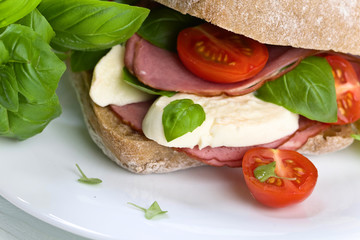 Ciabatta with ham , mozzarella, tomato and basil
