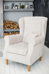 soft armchair in a room. Armchair with fabric upholstery