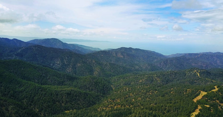 cedar valley. landscape of mountains in the mist Cyprus.Drone Point of View Platres in the Troodos. Cyprus. Aerial View. Flying over the mountains 