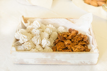 white meringues and cookies