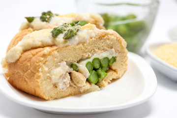 Rolled sponge cake filled with chicken and asparagus
