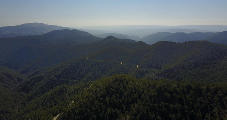 Fototapeta premium cedar valley. landscape of mountains in the mist Cyprus.Drone Point of View Platres in the Troodos. Cyprus. Aerial View. Flying over the mountains 