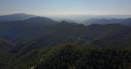 cedar valley. landscape of mountains in the mist Cyprus.Drone Point of View Platres in the Troodos. Cyprus. Aerial View. Flying over the mountains 