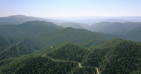 cedar valley. landscape of mountains in the mist Cyprus.Drone Point of View Platres in the Troodos. Cyprus. Aerial View. Flying over the mountains 