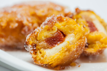 Typical Colombian aborrajados served on a white dish
