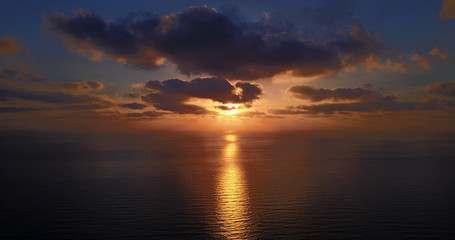 Brightly colored sunset over the calm Mediterranean Sea. Drone Point of View . Night