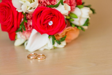 gold wedding rings on satin pillow