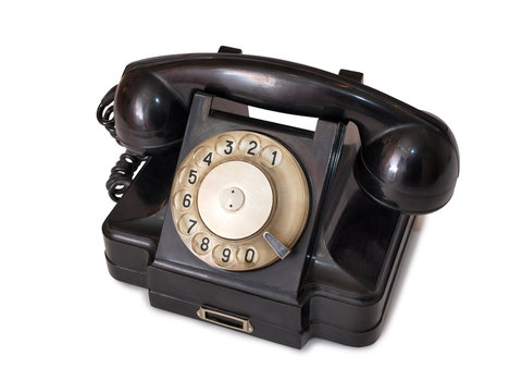 Vintage black telephone on white background