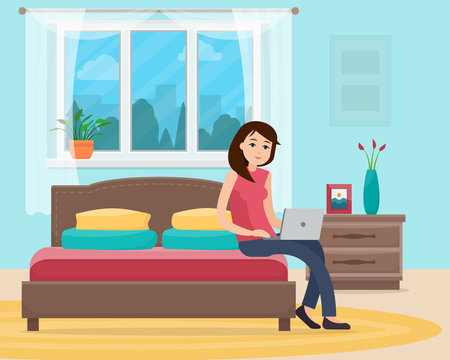 Freelancer woman with computer on bed
