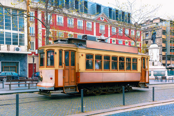 Fototapeta na wymiar Famous vintage tram on street of Old Town, Porto, Portugal