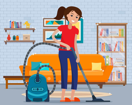 Woman cleaning room with vacuum cleaner.