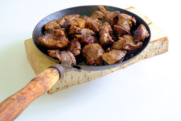 Cooking meat on an old vintage griddle