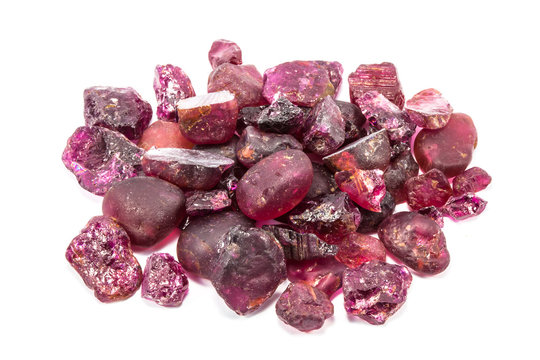Pile of raw natural ruby on white background