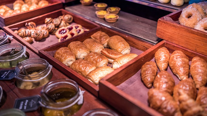 Croissant And Baked Bread On Wooden Tray
