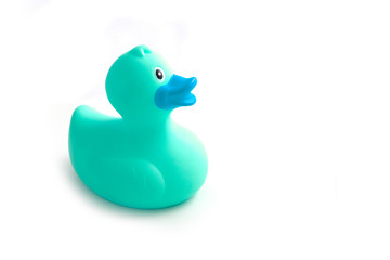 Photo depicting a green rubber duck, isolated on a white background. Children bath toy rubber ducky. Macro, close up view.