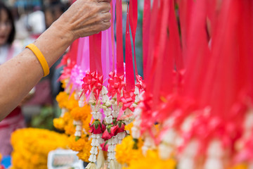 buddhist buy flowers for worship buddha statue on holy day