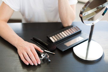 Woman applying make up