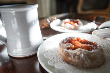 Fresh baked pastry and a cup of coffee for breakfast