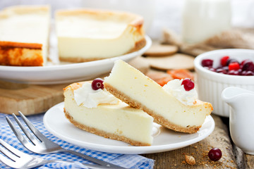 Slice of delicious cheesecake with whipped cream and berry © san_ta