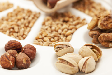 Nuts pistachios and grains on white