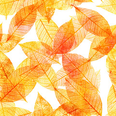 Seamless background pattern of golden tinted skeleton leaves