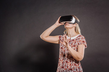 female with glasses of virtual reality. VR headset glasses device. Future technology concept.