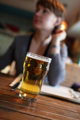 Woman with glass of beer