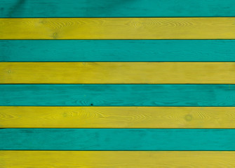 Yellow and green striped wooden background