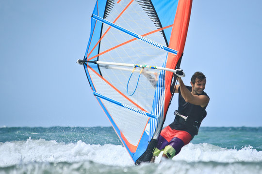 smiling happy windsurfer
