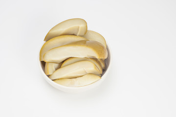 Pickled fermented mango on white bowl isolated white background