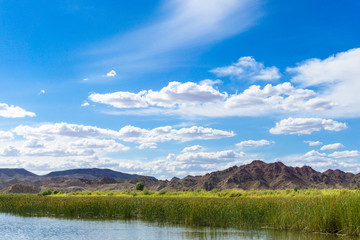 Fototapeta na wymiar Colorado river and mountains under blue sky in Yuma Arizona