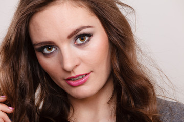 Obraz premium Portrait of happy attractive woman wearing grey top