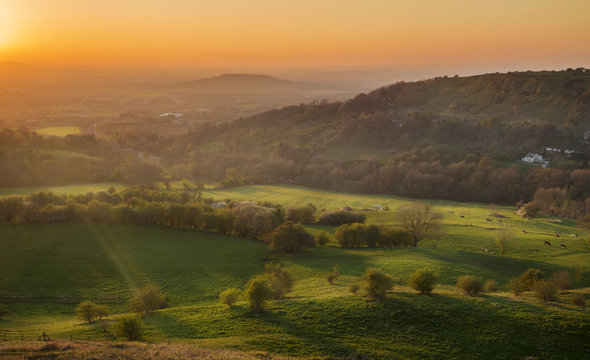 Scenic Warm Orange Sunset Sky over Gloucester Valley in England