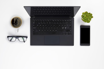 Contemporary white office desk with Laptop and Coffee Cup