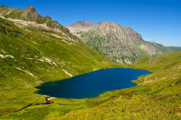 Naklejka na ściany i meble Mountain Lake in the mountains of Western Caucasus