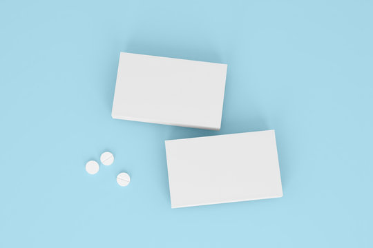 Two boxes of pills on the blue background. Pharmacy mockups for meds presentations, BADs and other kinds of pharmaceutical products. Top view.