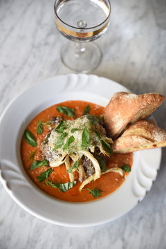 Close-up of food garnish with herbs and cheese served with bread